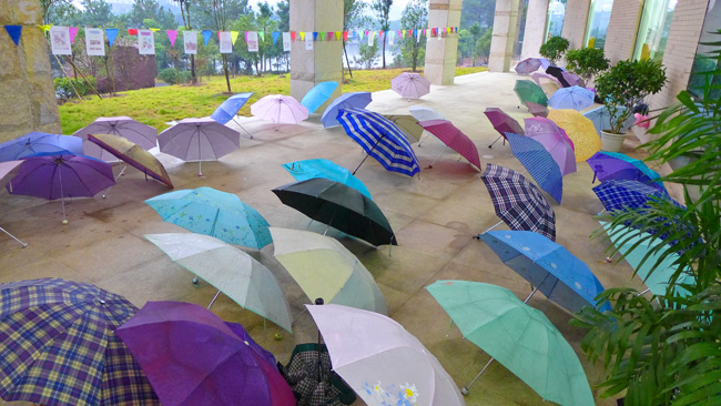 [© Umbrella Confab by Judy Hill Lovins is described with Fine Art, China, Color, Horizontal, Spring, Summer, Umbrella, Green, Purple, Pink, Blue hit 10658 rate ]